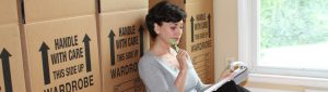 woman sitting with boxes